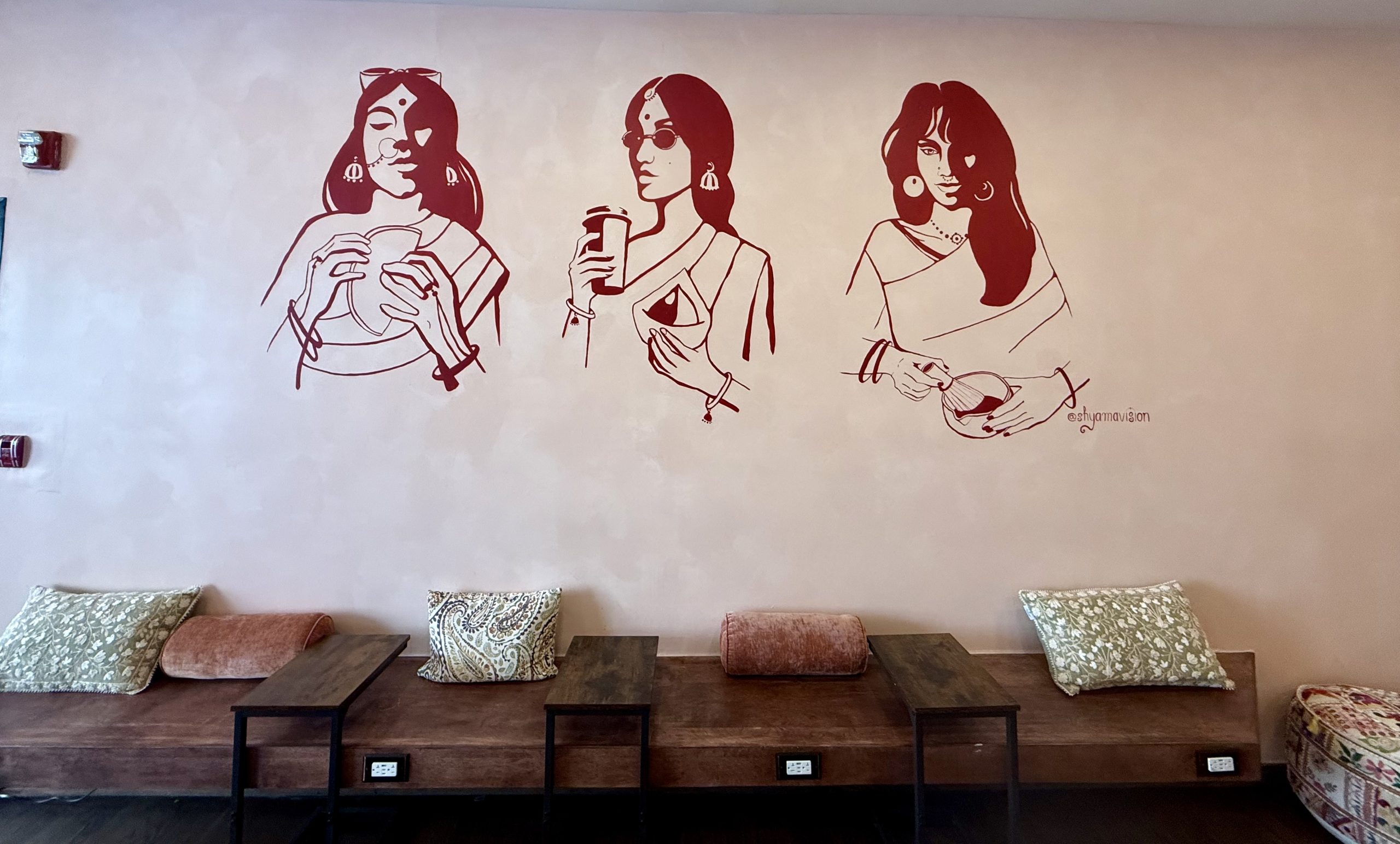 say-she-ate-mural-indian-women-bench-seating.jpg