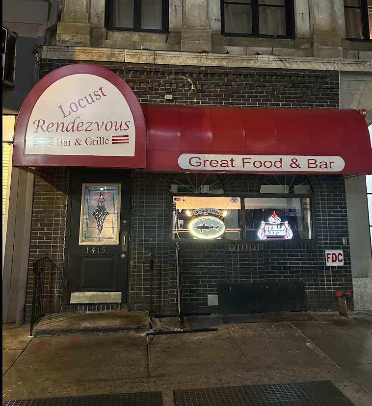 Exterior of Locust Rendezvous Bar & Grille on Locust Street, with a red arched awning reading "Great Food & Bar" over a dark tiled facade.