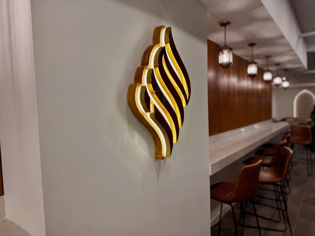 haraz-illuminated-logo-wall-sconce